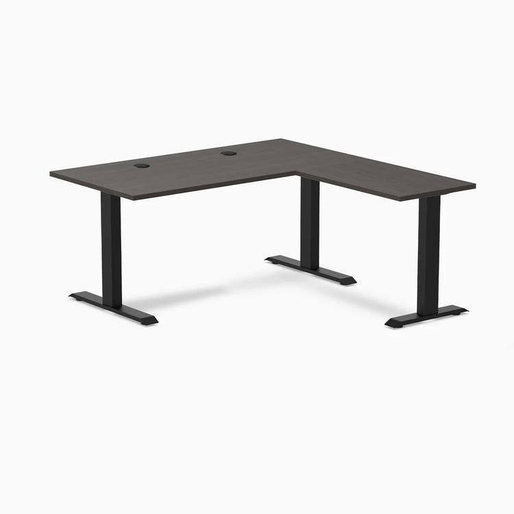 Burnished Wood L-shape office desk with matte black steel frame and grommets.