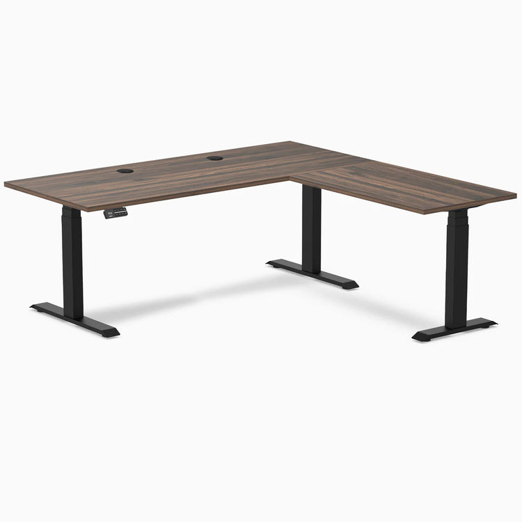 Desky L-Shape Laminate Sit Stand Desk in Jarrah Legno with Matte Black legs and grommets.