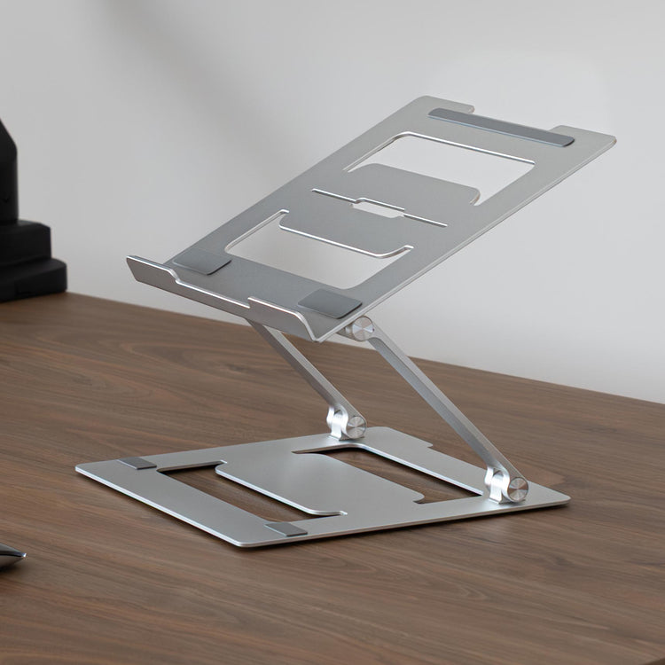 Laptop riser on top of desk