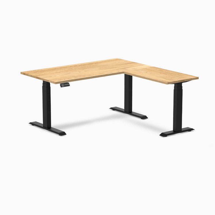 White Oak L-Shape sit-stand desk with matte black triple electric motor base.