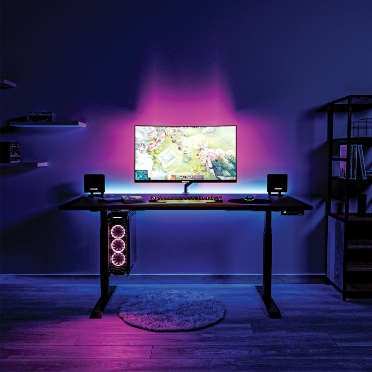 sit stand gaming desk in home office with leds