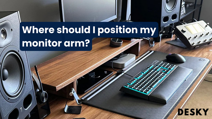 Where should I position my monitor arm?