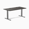 Desky Zero fixed height office desk with burnished wood laminate top, grommets, and space gray steel frame.