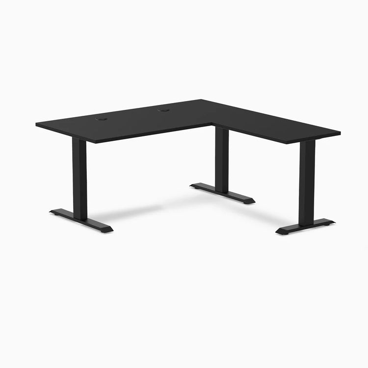 Black Desky Zero Laminate L-Shape Office Desk with grommets and matte black steel frame.
