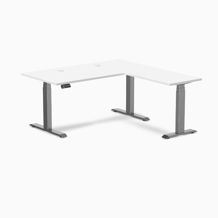 White Desky L-Shape Laminate Sit Stand Desk with Space Gray triple electric motors and grommets.