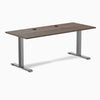 Desky Zero fixed height office desk with Jarrah Legno laminate top, Space Gray steel frame, and two grommets.