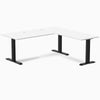 White laminate L-shape office desk with matte black steel frame and grommets.