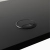 Black grommet hole on black desk
