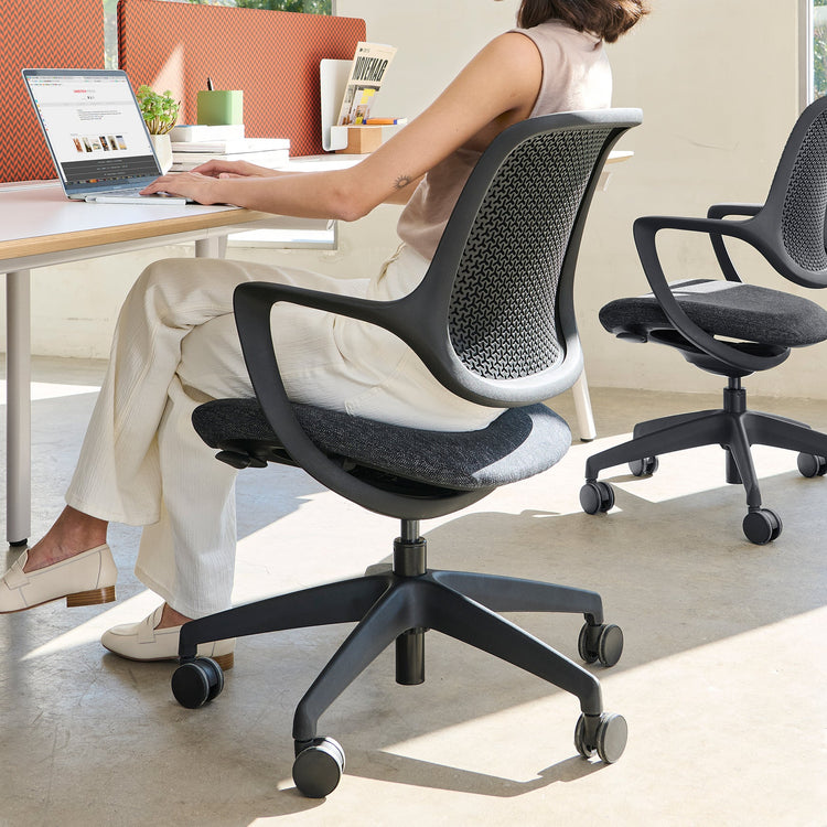 Black ergonomic evoque low back chair in office