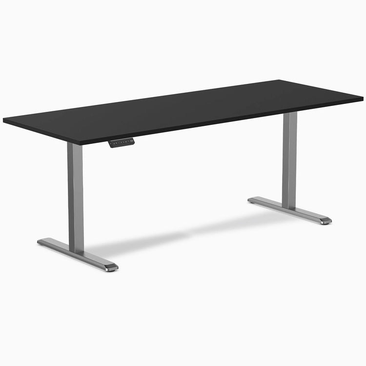 Desky Single Sit Stand Desk with a black rectangular desktop and silver height-adjustable frame.