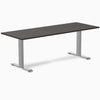 Desky Zero fixed height office desk with dark laminate top and silver steel frame.