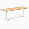 Desky Zero fixed height office desk with a White Oak hardwood top and white steel frame.
